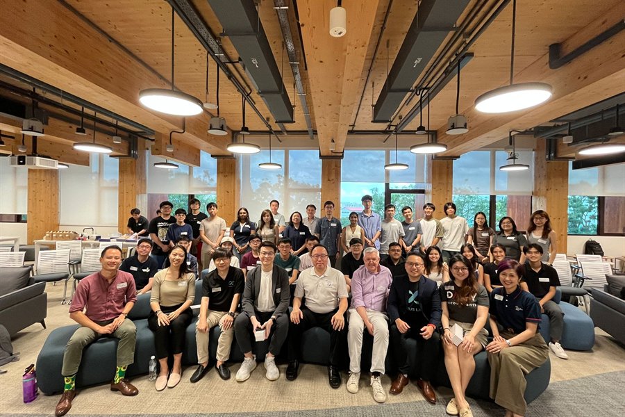 Large cohort group photo at an AI training session