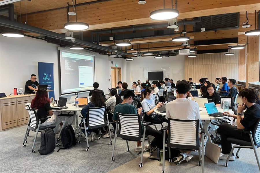 AI workshop participants working on laptops during a hands-on session