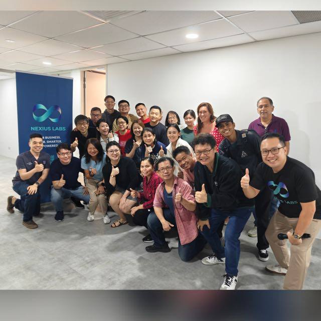 Nexius Labs workshop participants and trainers giving thumbs up after a session
